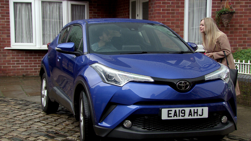   David Platt berie Sarah's car as she tries to talk to him in Coronation Street.