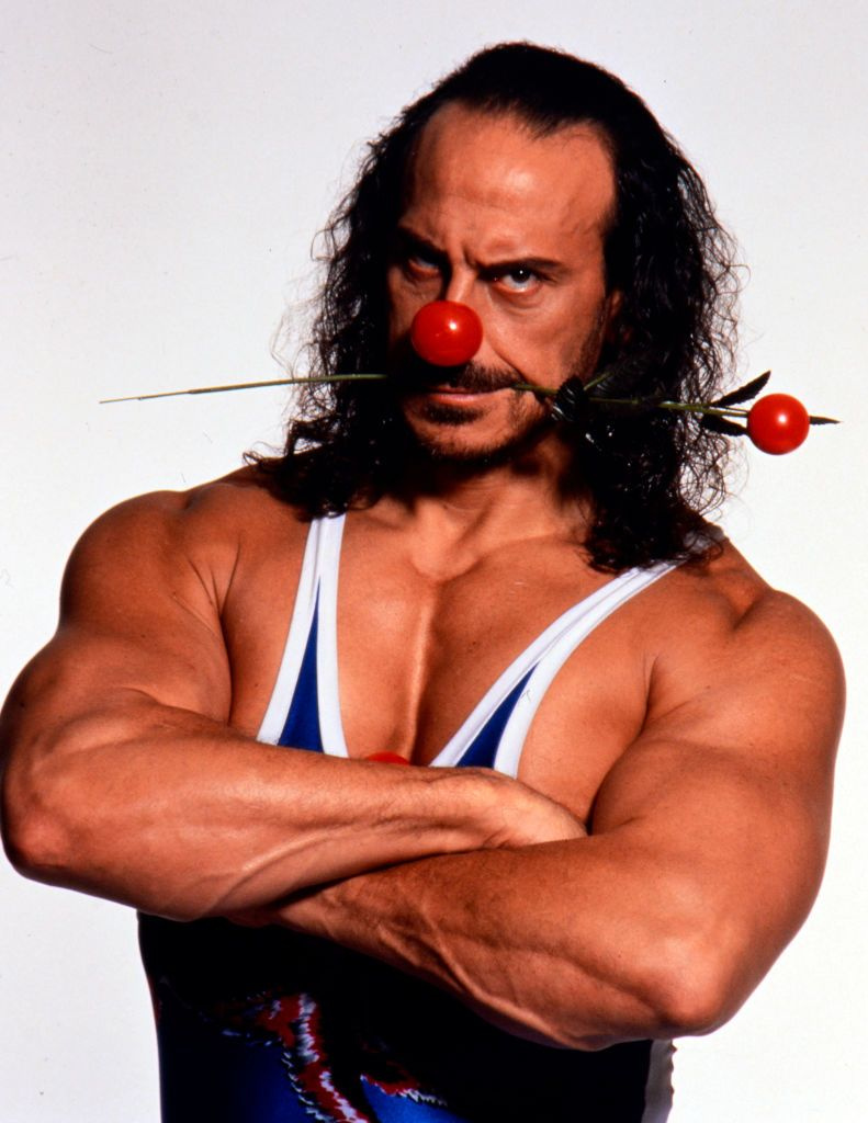 Hunt filmist Gladiators, kes poseerib 1990. aastatel Comic Relief jaoks