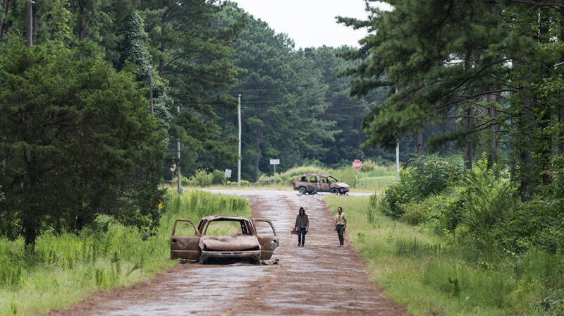 Andrew Lincoln as Rick Grimes, Chandler Riggs as Carl Grimes