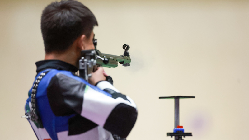 Zhang Changhong reprezentând China la evenimentele de tir olimpice de la Tokyo 2020.