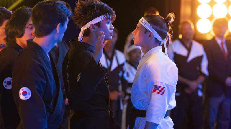   Brandon H. Lee като Kwon, Tanner Buchanan като Robby Keene в Cobra Kai