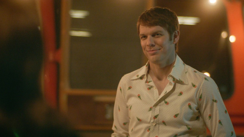   Jake Lacy Robertina"B" Berchtold smiling in A Friend of the Family